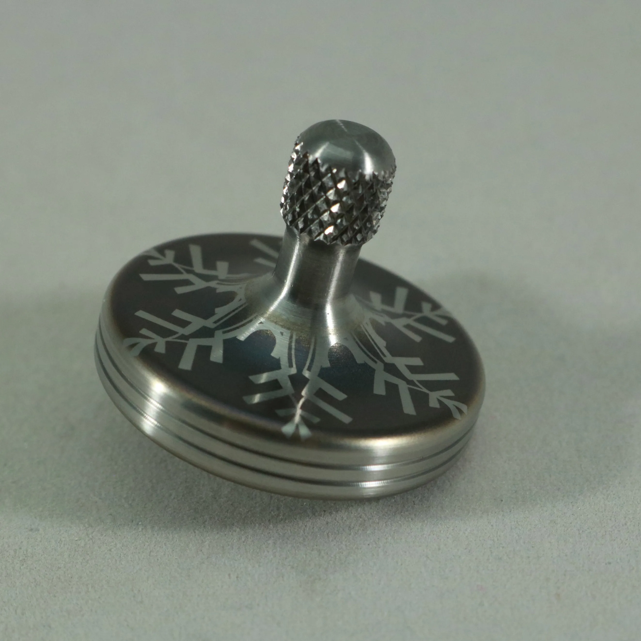 S2- Laser Etched  Inverted Snowflake on a Stainless Steel Spinning Top V2
