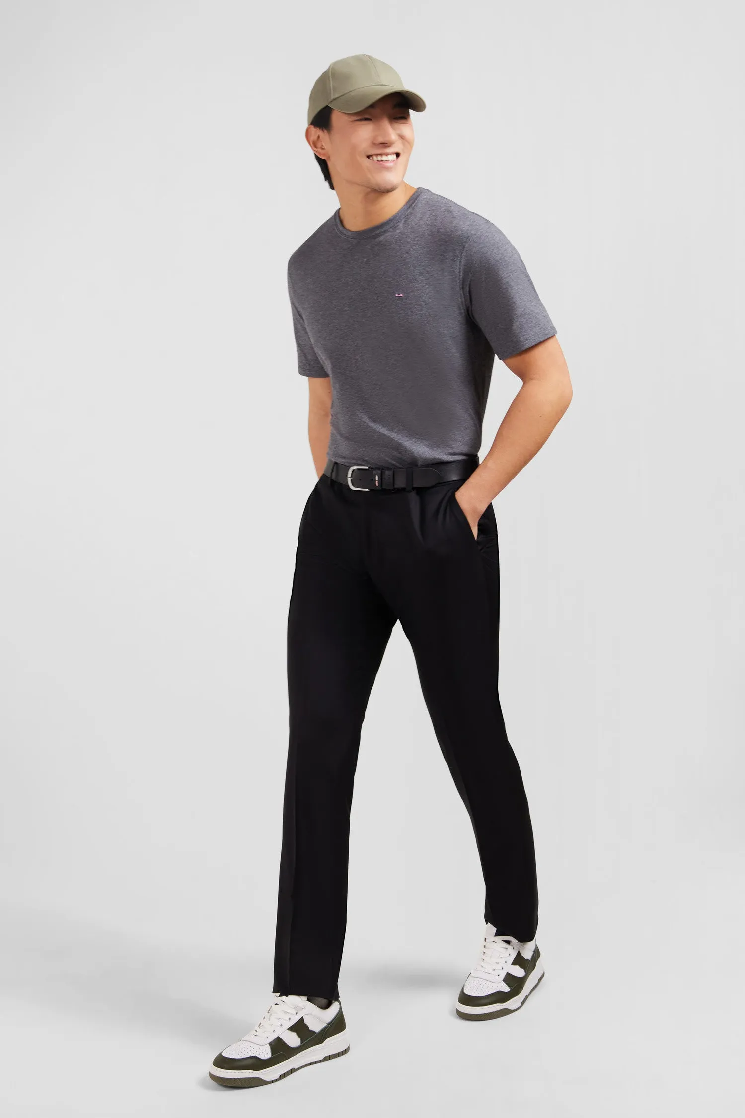 Slim black wool trousers with broken fold
